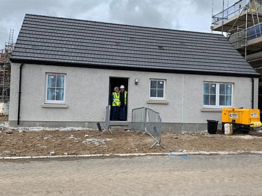 Margaret and Alex visiting their new home